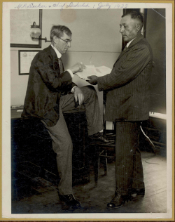 George P. Decker and Chief Deskaheh reviewing a document in July 1928