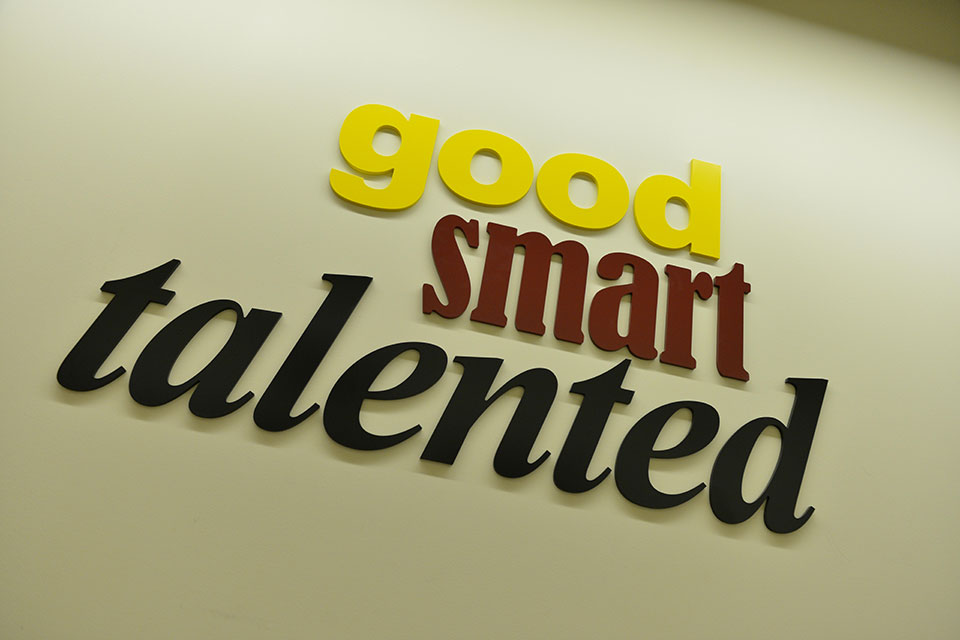 A sign in the Ralph C. Wilson, Jr. Athletic Center reads: Good, Smart, Talented.