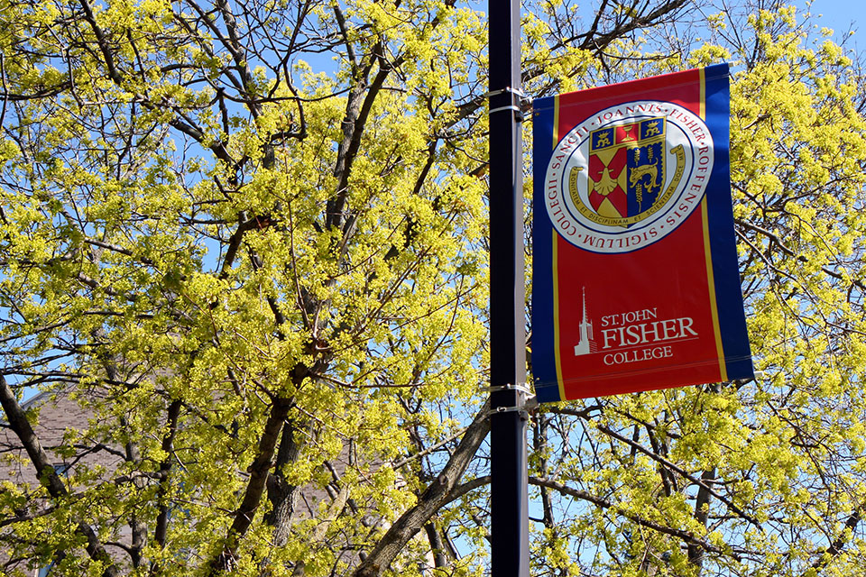 A banner displays the Presidential Seal at St. John Fisher College.