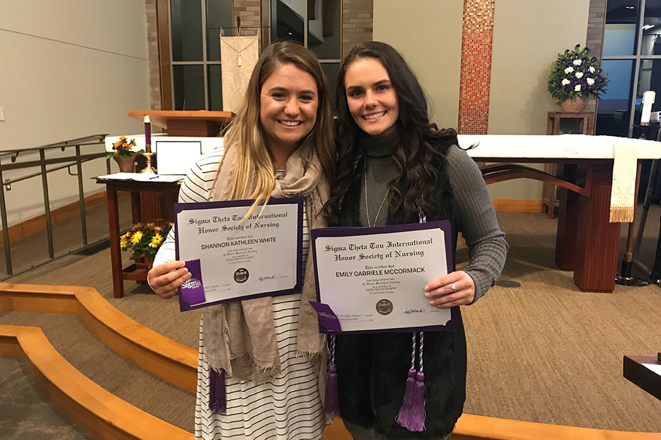Shannon White and Emily McCormack were among the nursing students inducted into Sigma Theta Tau honor society.