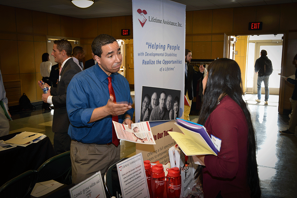A recruiter and student talk during the 2018 Career Fair.