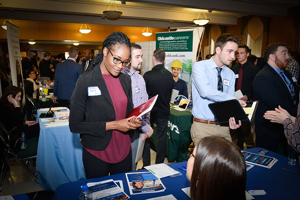 A student talks with a potential employer at the annual Career Fair.