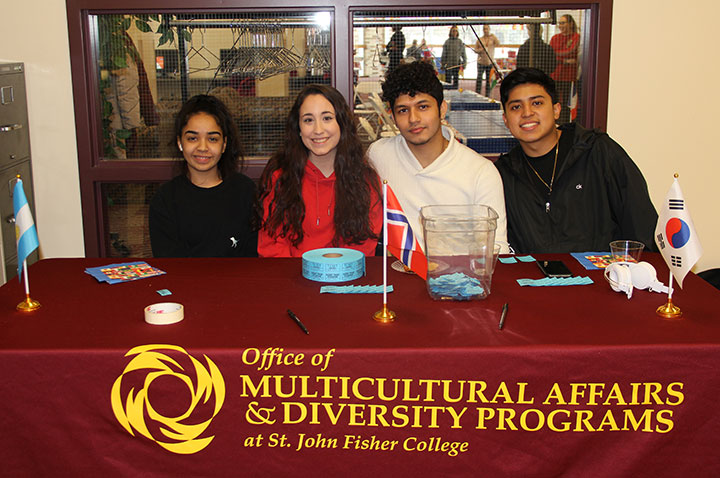 Students welcome visitors to the Study Abroad Festival.