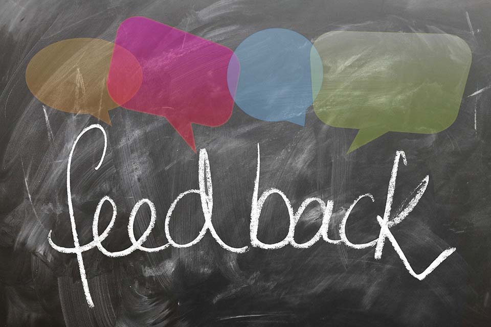 The word feedback is written on a chalkboard.