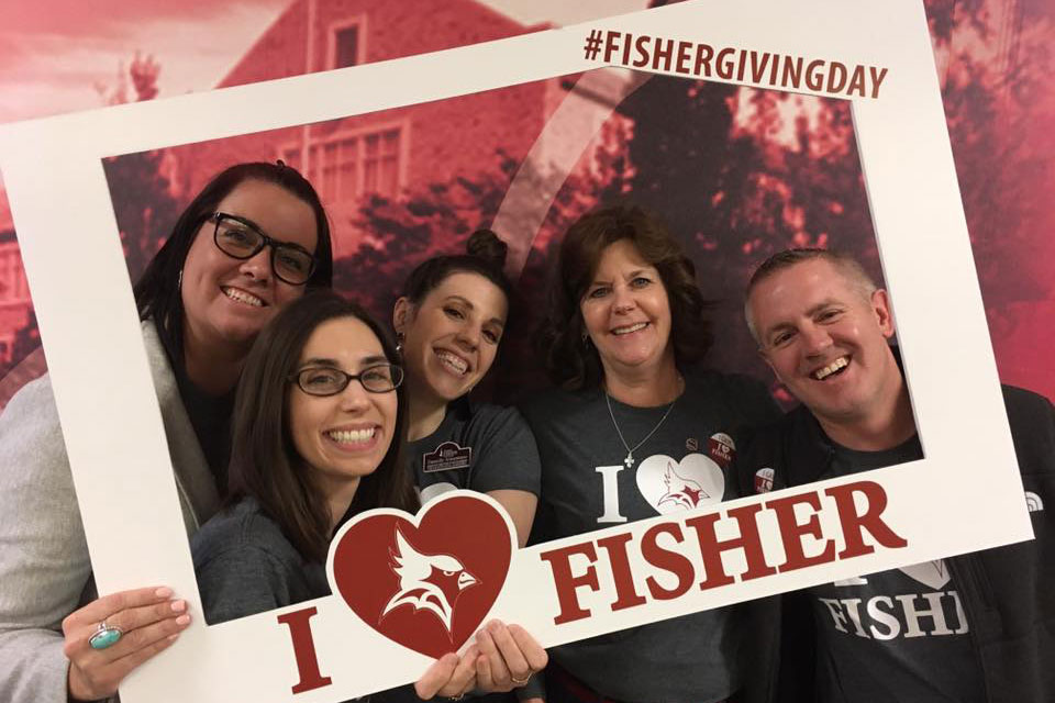 Members of the Fisher family celebrate I Heart Fisher Day of Giving.