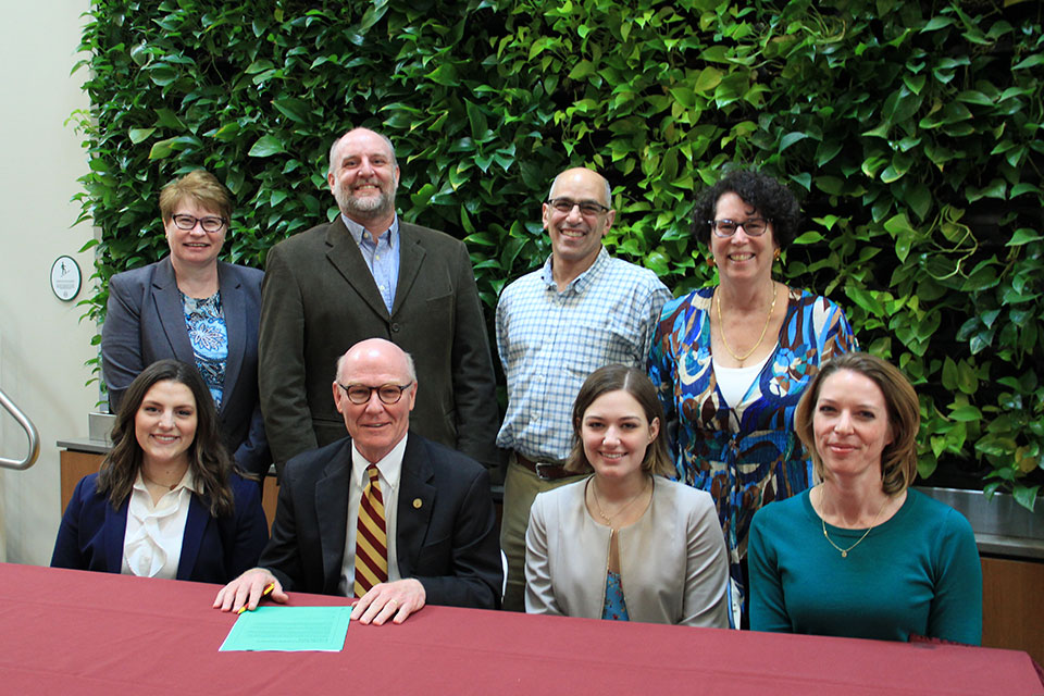 During a brief ceremony on Wednesday, May 8, President Rooney, who was joined by Fisher students and faculty and representatives of Our Climate, signed an open letter urging state and federal lawmakers to proactively work to enact legislation that would put a price on carbon emissions and transition to a clean energy economy.