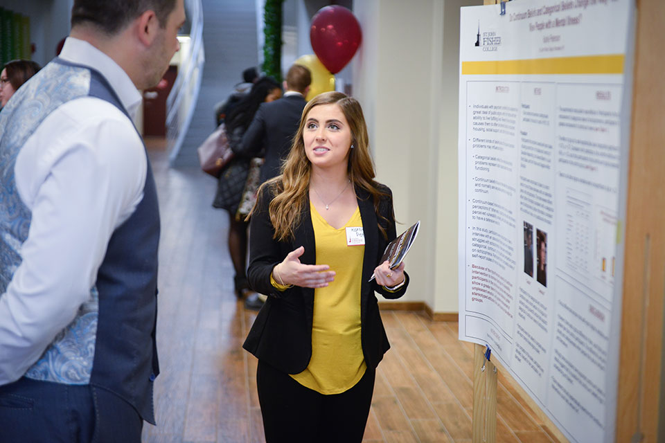 A student shares research at the Student Research and Creative Work Symposium.