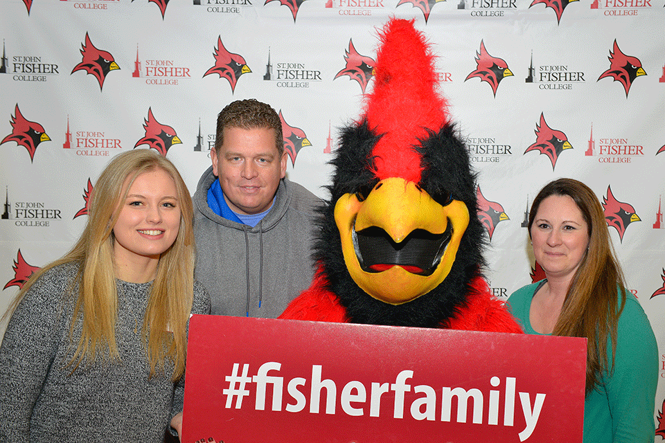 Alyssa Karl and her family pose with Cardinal during an accepted student open house in 2017.