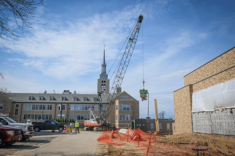 A crane moves material at the site of Lavery Library renovations.