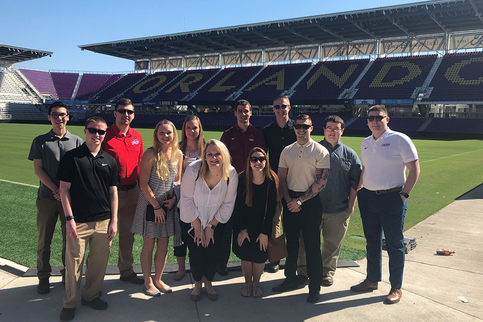 Skylar Swatt (center) with fellow sport management majors during a trip to Orlando.