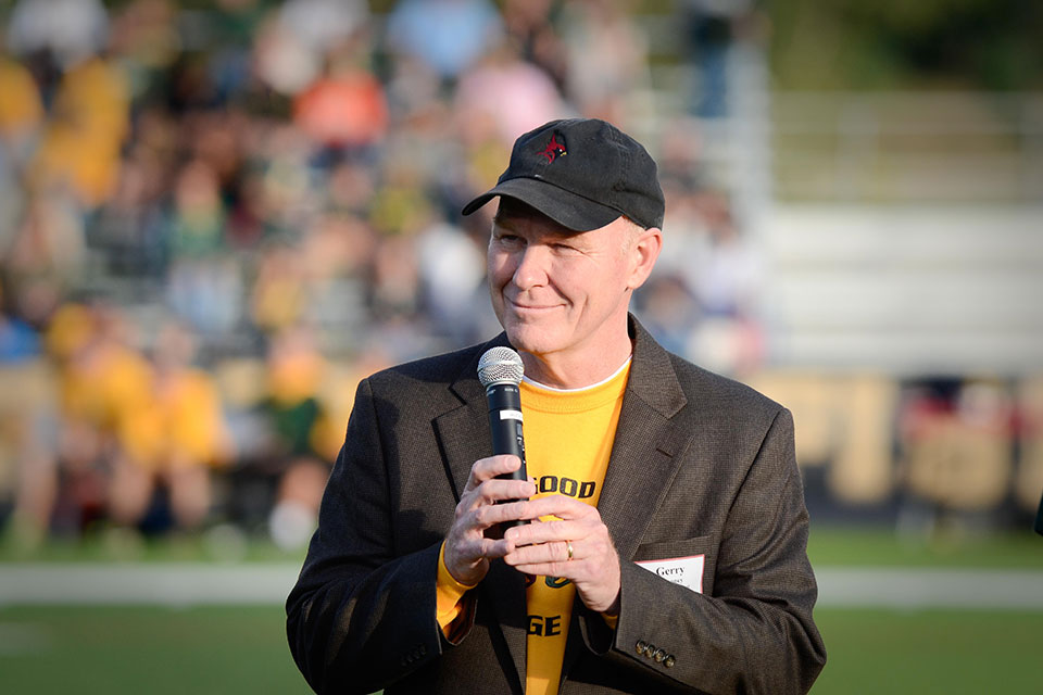President Rooney addresses a crowd at the Courage Bowl in 2015.