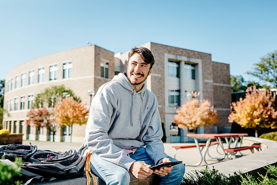 An image from the new campaign features an undergraduate student in LeChase Commons..