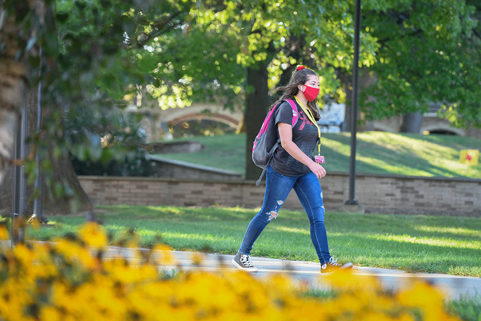 Students walk through St. John Fisher College's campus.