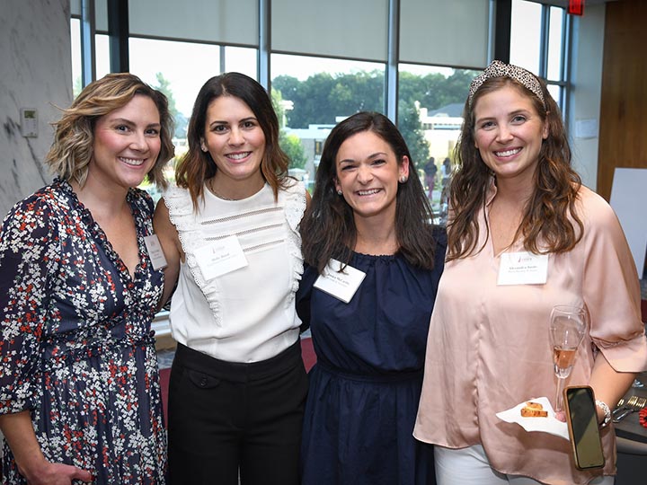 Attendees at a recent Women in Family Business event pose together.