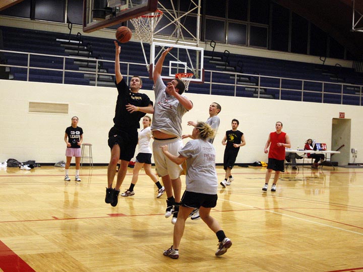 Take a break from studying and get some exercise by joining an intramural team, like this co-ed basketball league.