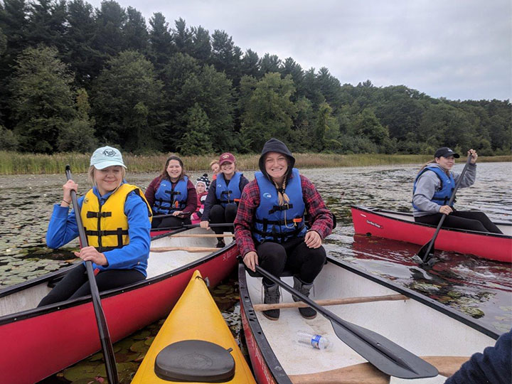 Students explore local waterways via kayak.