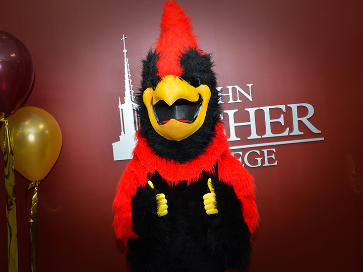 The Cardinal mascot giving two thumbs up!